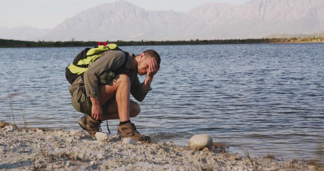 Exhausted Hiker Resting Near Mountain Lake - Download Free Stock Images Pikwizard.com