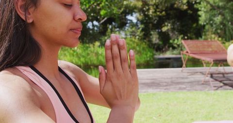 Woman Practicing Yoga with Closed Eyes in Peaceful Park