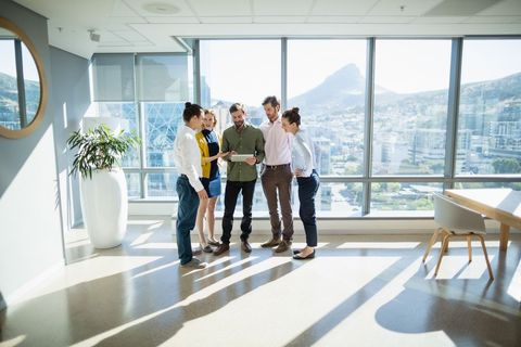 Business Executives Collaborating in Modern Office Setting