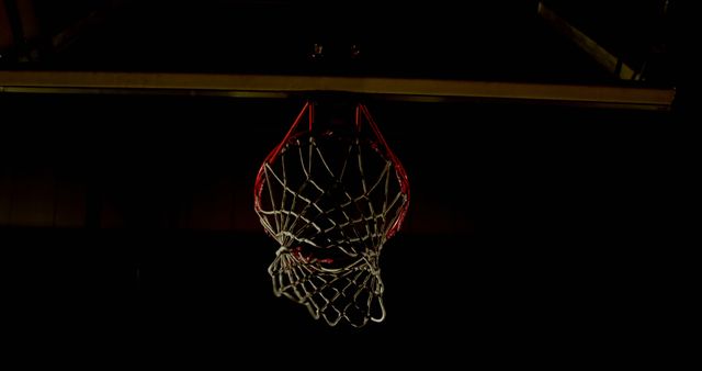 Basketball Hoop Close-Up in Darkness with Low Lighting - Download Free Stock Images Pikwizard.com