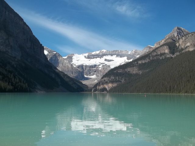 Serene Mountain Lake with Majestic Glacier and Clear Blue Sky - Download Free Stock Photos Pikwizard.com