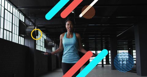Woman jumping rope in urban industrial environment