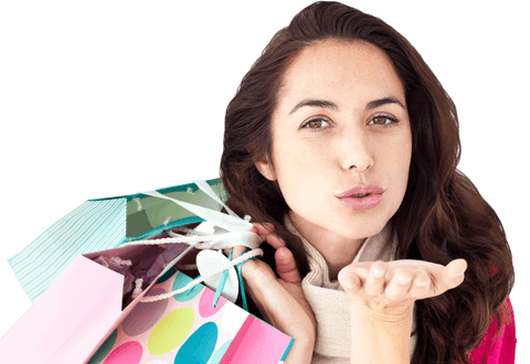 Woman sending kiss while holding shopping bags on transparent background
