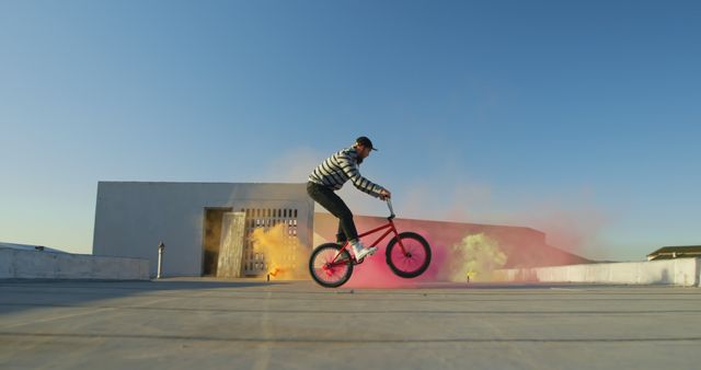 BMX Rider Performing Tricks with Colorful Smoke Outdoors - Download Free Stock Images Pikwizard.com