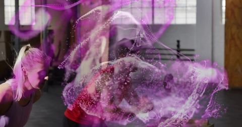 Athletes training in warehouse gym with neon purple motion swirl overlay