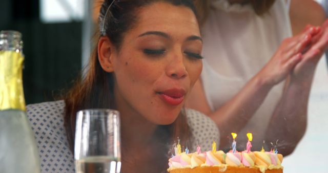 Woman Blowing Out Candles on Birthday Cake - Download Free Stock Images Pikwizard.com