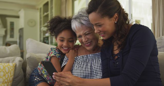 Three Generations of Women Enjoying Time Together on Couch - Download Free Stock Images Pikwizard.com