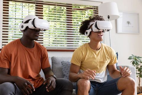 Diverse Friends Enjoying VR Gaming Experience at Home