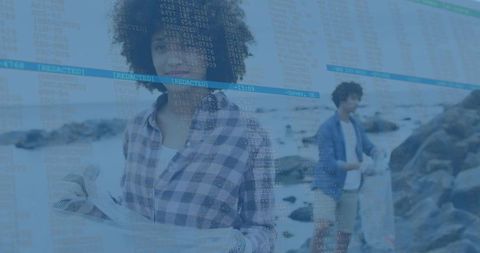 Volunteers collecting coastal trash on rocky shore with code overlay showing redacted
