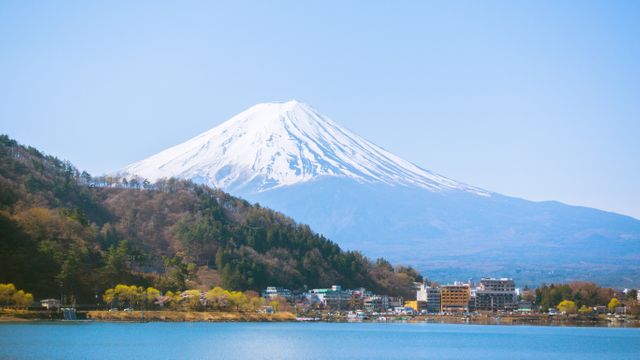 Snow Capped Mount Fuji Overlooking Serene Lake Kawaguchi and Town - Download Free Stock Photos Pikwizard.com