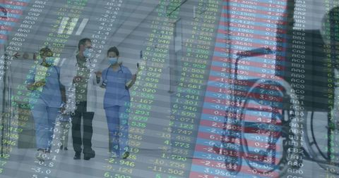 Healthcare Professionals Walking with Stock Market Data Overlay