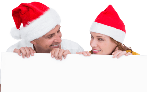 festive couple with santa hats holding transparent cardboard - Download Free Stock Videos Pikwizard.com