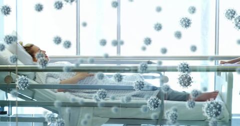 Healthcare Professionals Transporting Female Patient in Hospital