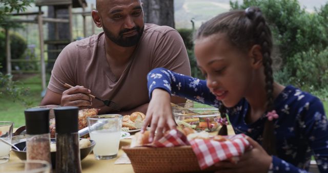 Outdoor Family Picnic with Father and Daughter Enjoying Meal - Download Free Stock Images Pikwizard.com