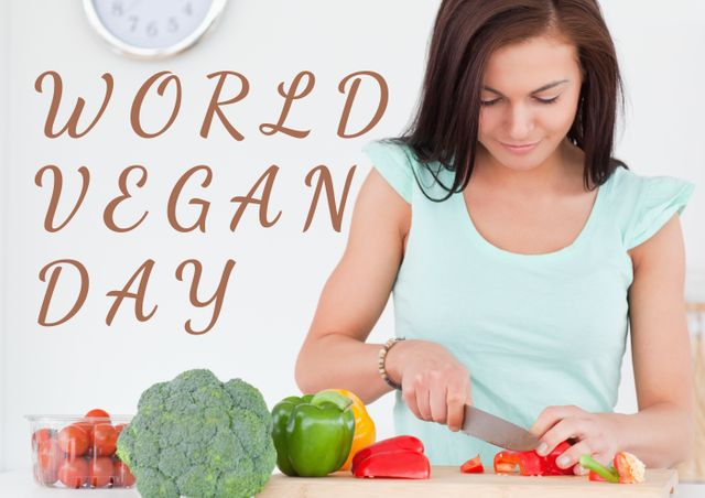 Digital composite image of world vegan day text by woman cutting vegetables. healthy lifestyle and vegetarianism.