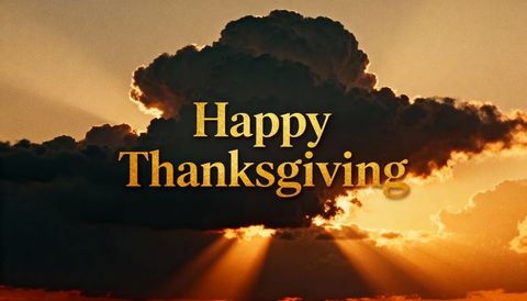 Golden happy thanksgiving text over dramatic sunset clouds with sunbeams and amber rays