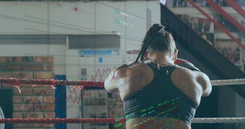 Woman Boxing with Digital Data Overlay in Gym