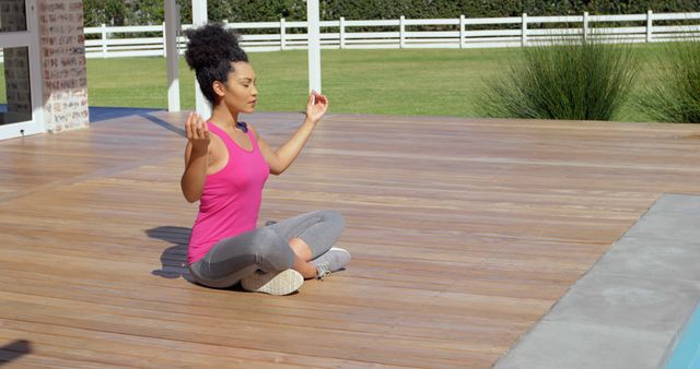 Young Woman Meditating Outdoors on Wooden Deck - Download Free Stock Images Pikwizard.com