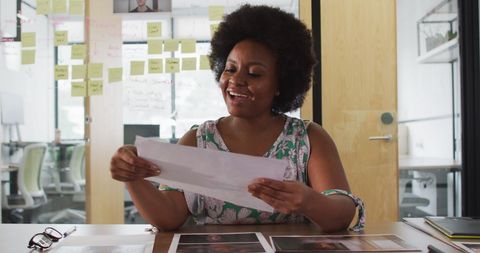 Businesswoman Presenting Ideas During Virtual Meeting in Office