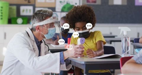 School nurse measuring temperature of student in classroom