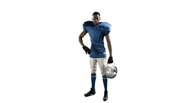 African American football player in blue jersey and white pants holding helmet. Ideal for sports promotions, athletic event marketing, team branding materials, or fitness-related content.