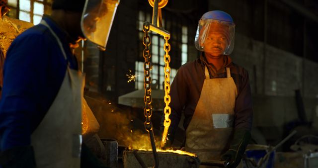 Workers Operating Forge with Protective Gear in Industrial Foundry - Download Free Stock Images Pikwizard.com