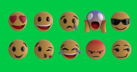 Colorful 3d emoji faces on green screen background