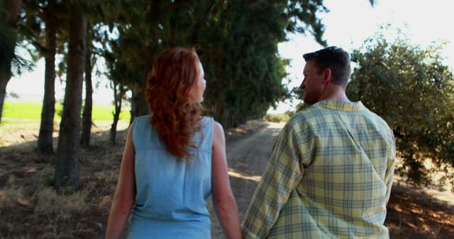 Couple Walking in Countryside Holding Hands - Download Free Stock Images Pikwizard.com