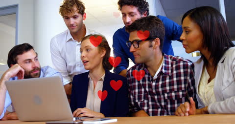 Diverse Team Collaborating on Laptop Adventure