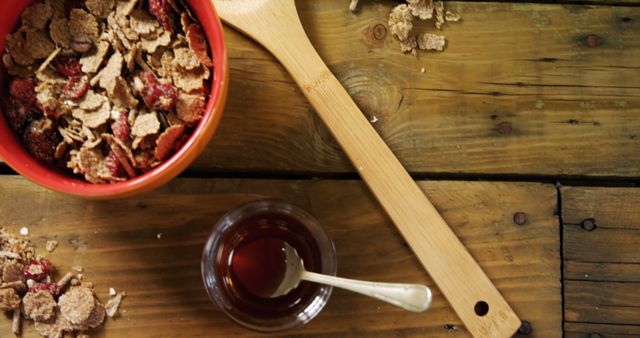 Healthy Breakfast with Cereal Bowl, Honey, and Wooden Spoon on Rustic Table - Download Free Stock Images Pikwizard.com