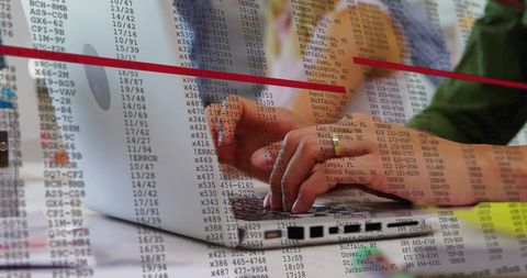 Businesswoman analyzing financial data on laptop in office setting