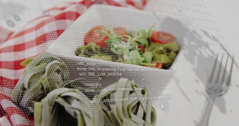 Combining Fresh Tomato Salad and Spinach Tagliatelle with Digital Code World Map Overlay