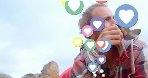 Man Drinking Coffee with Floating Social Media Hearts