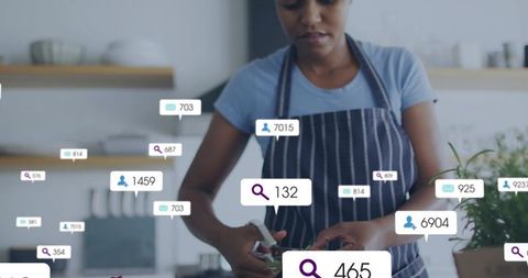 Home cook trimming fresh herbs while engaging with social media analytics overlays