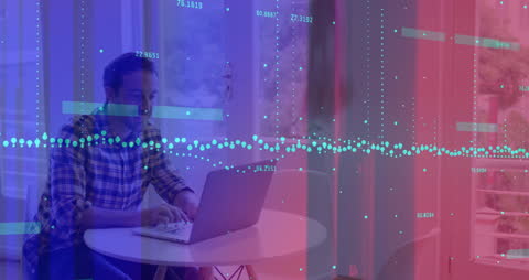 Businessman Analyzing Digital Data on Laptop in Modern Office