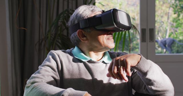 Senior Man Exploring Virtual Reality at Home - Download Free Stock Images Pikwizard.com