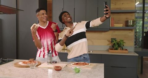 Diverse Friends Taking Selfie While Making Homemade Pizzas in Modern Kitchen