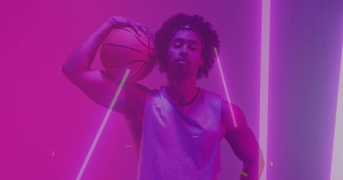 Vibrant Athlete Holding Basketball with Neon Geometrics