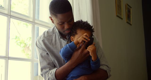 Loving Father Bonding with Child by Window - Download Free Stock Images Pikwizard.com