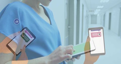 Nurse using tablet for telemedicine, messaging overlays in hospital corridor