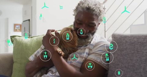 Man relaxing with dog and floating digital energy icons