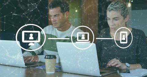 Colleagues collaborating on laptops with digital network overlay for remote teamwork