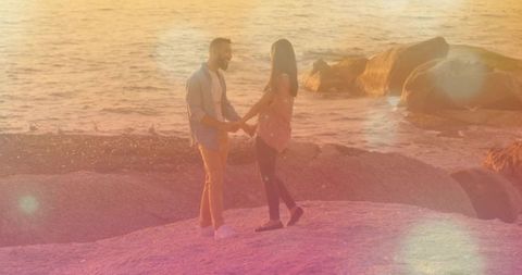 Romantic Sunset at Rocky Shoreline with Couples in Love