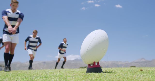 Rugby Players Ready for Kickoff at Sunny Field with Mountains - Download Free Stock Images Pikwizard.com