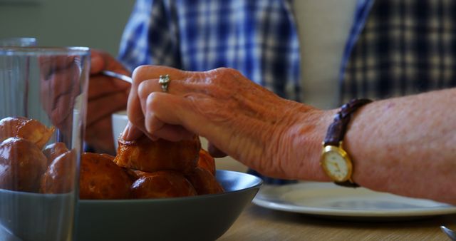 Two Elderly People Enjoying Freshly Baked Bread Rolls - Download Free Stock Images Pikwizard.com