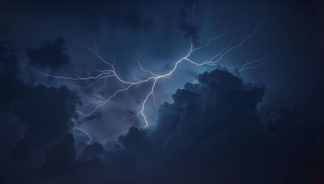 Dramatic Night Sky Lit by Central Lightning Bolt with Storm Clouds