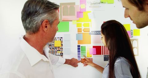 Team collaborating on strategic planning with colorful sticky notes