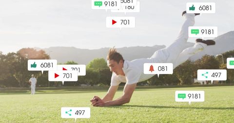 a caucasian male cricket player diving on a field, surrounded by social media engagement icons like likes, and comments. represents the integration of sports with digital media and technology. useful for illustrating concepts related to sports branding, fan interaction, and digital engagement analytics.