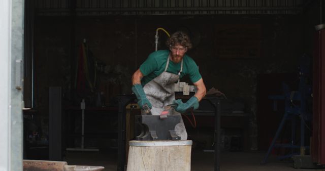 Blacksmith Hammering Metal in Workshop - Download Free Stock Images Pikwizard.com