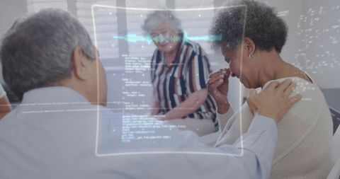 Comforting caregiver consoling elderly woman during counseling with holographic data overlay